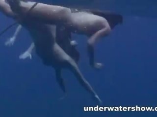 Three girls swimming nude in the sea