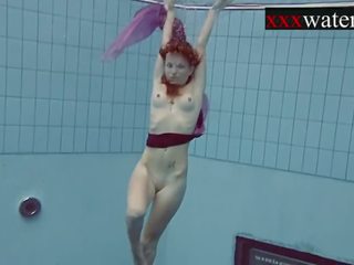 Smoking outstanding Russian redhead in the pool