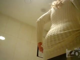 Attractive blonde in toilet shaved pussy and anus closeups.